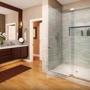 Frameless heavy-glass enclosures are a huge design trend because they give a bathroom that spacious, luxury spa-like feeling homeowners want.
